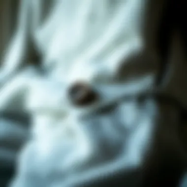 Close-up of fabric texture and button details on fashionable sweatpants