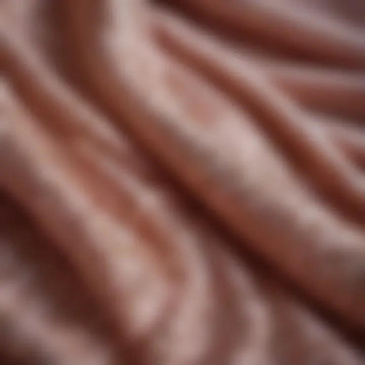 Close-up of luxurious fabric textures used in ladies' blouses.