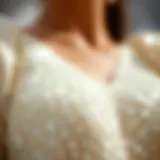 Close-up view of shimmering white sequins on fabric reflecting light elegantly.
