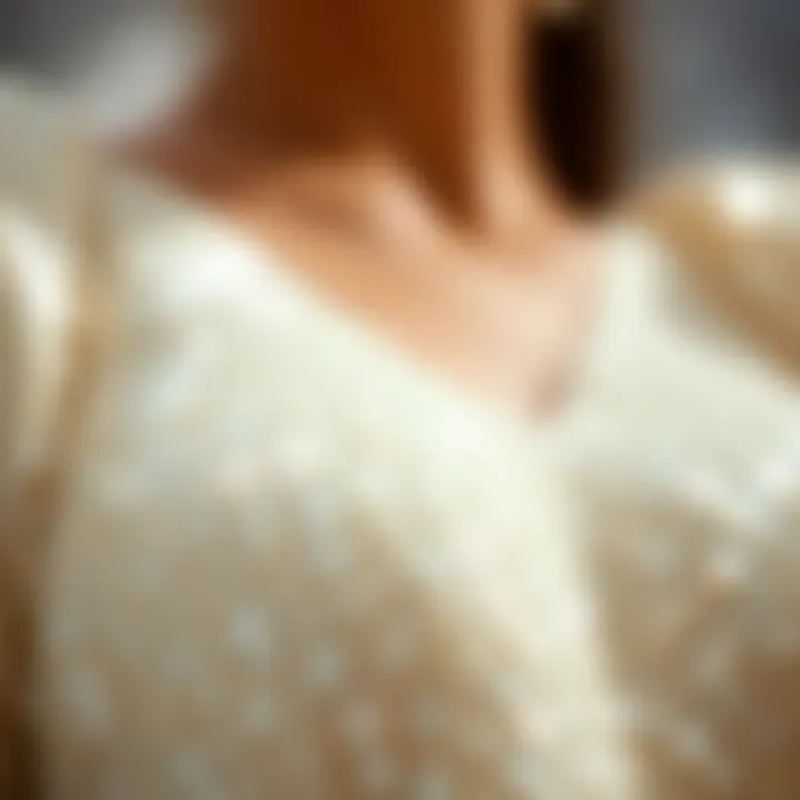 Elegant Reflection of White Sequins Close-up view of shimmering white sequins on fabric reflecting light elegantly.