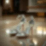 Elegant strappy silver heels on a reflective surface