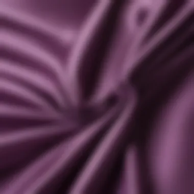 Close-up of purple satin fabric showcasing its sheen and texture