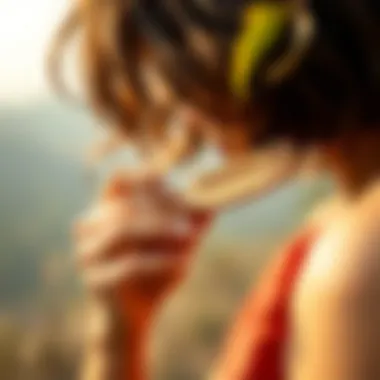 Person using a peach wood comb in a serene setting