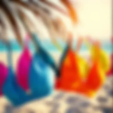 Stylish arrangement of zip front bikini tops in various colors displayed on a beach backdrop.