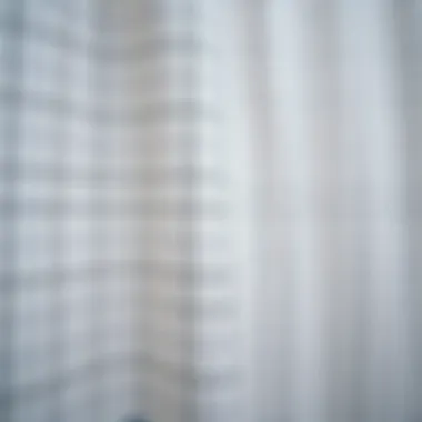 Close-up of fabric showcasing the grid pattern and texture of a shower curtain