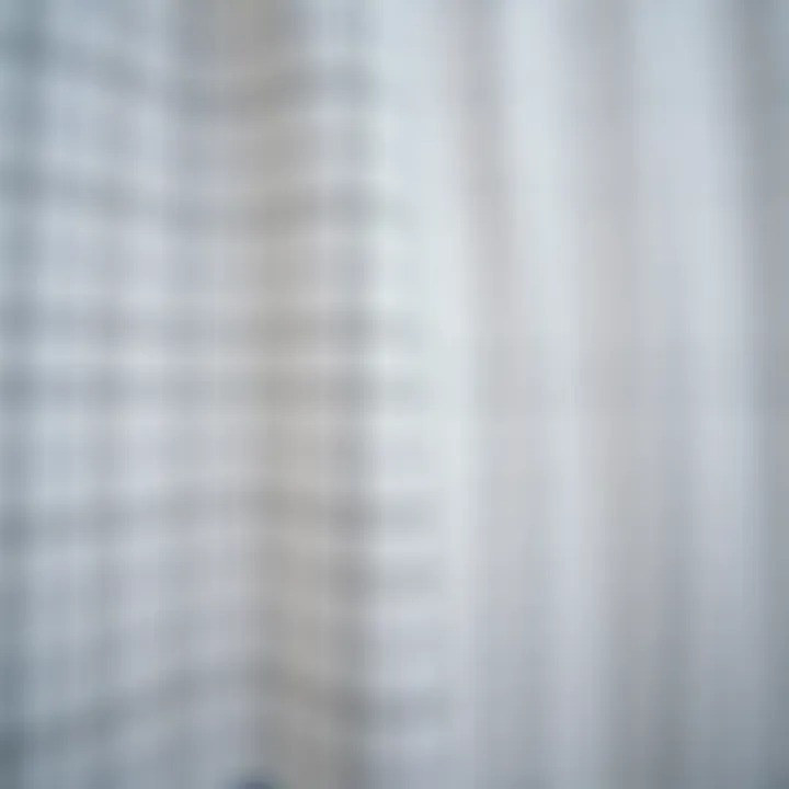 Close-up of fabric showcasing the grid pattern and texture of a shower curtain