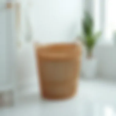 A modern low profile laundry basket in a minimalistic setting