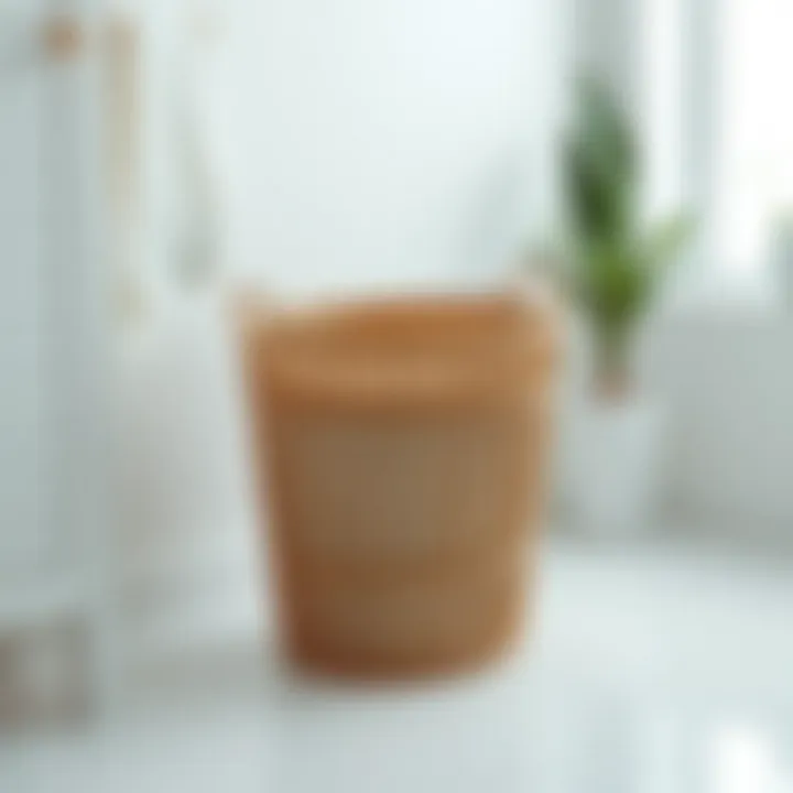 A modern low profile laundry basket in a minimalistic setting