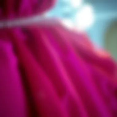 Close-up of luxurious fabric used in magenta evening gowns