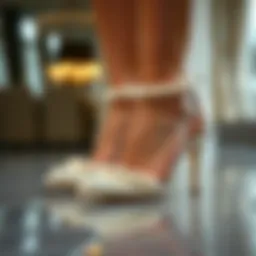 Elegant pearl ankle strap heels on a reflective surface