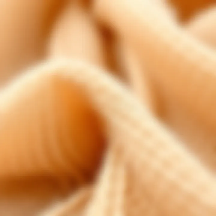 Close-up of luxurious beige pashmina fibers showcasing their delicate texture.