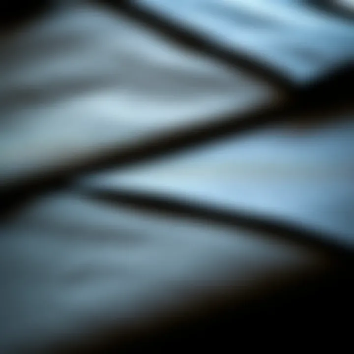 Close-up of gray fabric swatches for suits displaying texture and quality.