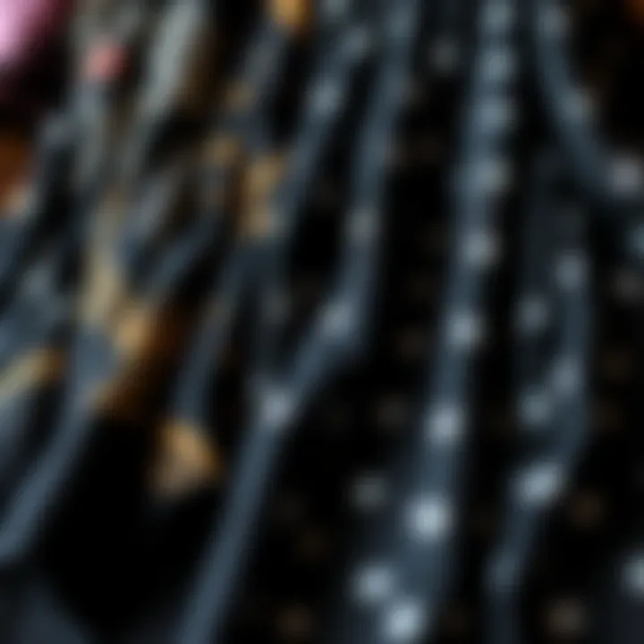 Various fabric choices for black printed scarves displayed together