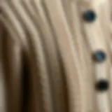 A close-up of a knitted cardigan showcasing intricate patterns and textures.