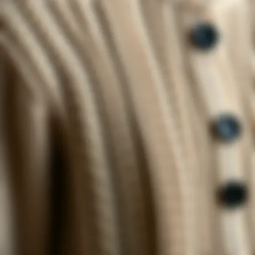A close-up of a knitted cardigan showcasing intricate patterns and textures.