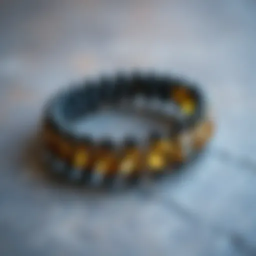 Glistening black tourmaline and citrine bracelet resting on a textured surface