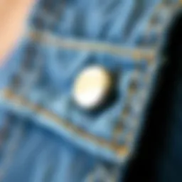 Close-up of a unique button pin design on denim