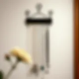 Elegant wall-mounted necklace hanger displaying assorted jewelry pieces
