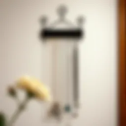 Elegant wall-mounted necklace hanger displaying assorted jewelry pieces