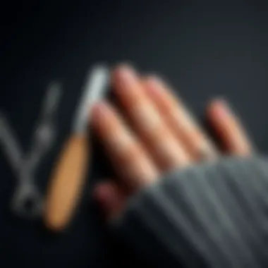 Nail scrapers arranged aesthetically next to manicured nails